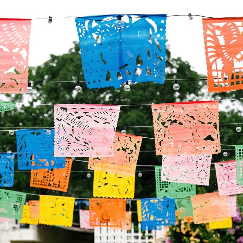 Colorful paper flags hang over the courtyard of Casa Hope.